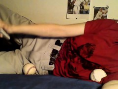 Horny dude uses a baseball and bat to rub on his balls whil