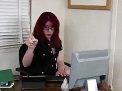 Redhead tranny plays with her cock in the office
