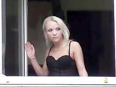 Blonde pees out the window of her apartment