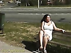 Pissing and pussy rubbing in public for curvy chick