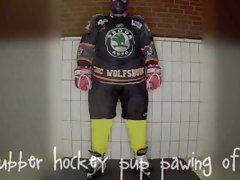 Rubber hockey pup pawing off